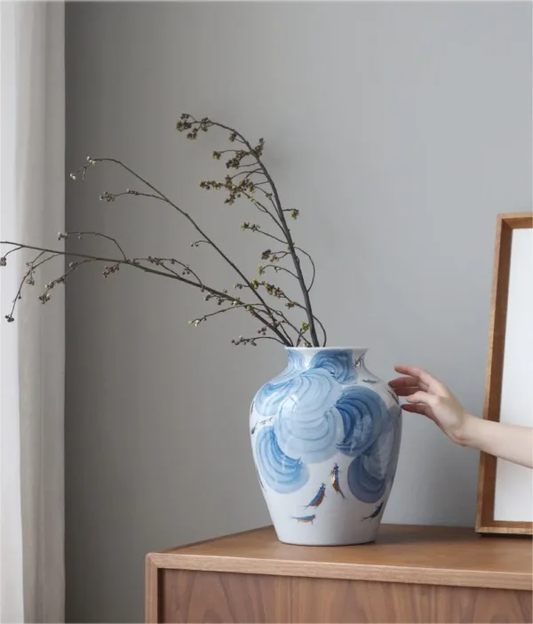 Hand-Painted Blue Wave Flat-Base Jar with Gold Fish, Large in blue — in a room setting