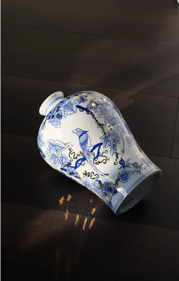 Hand-Painted Blue and White Grape and Bird Plum Vase in blue — in a room setting