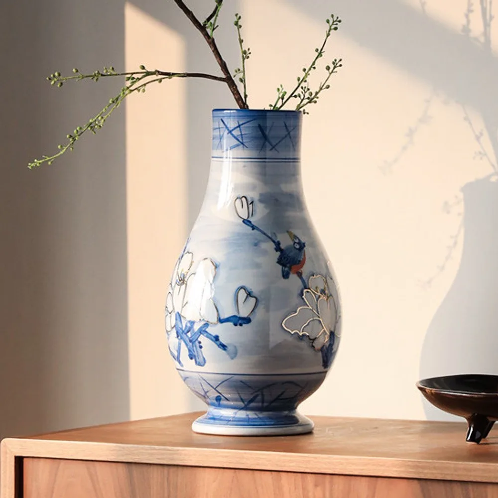 Hand-Painted Blue and White Porcelain Vase with Gilt Detail in blue — front view