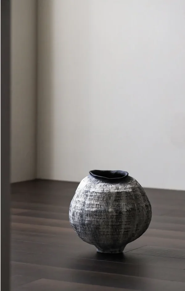 Jingdezhen Grid-Textured Grey Moon Jar, Large or Small in slate — in a room setting