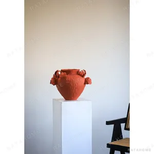 Red Ceramic Jar Vase with Sculpted Leaf Handles, Jingdezhen in red — in a room setting