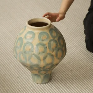 Jingdezhen Celadon Circle Pattern Round Jar Vase, Large in olive — in a room setting