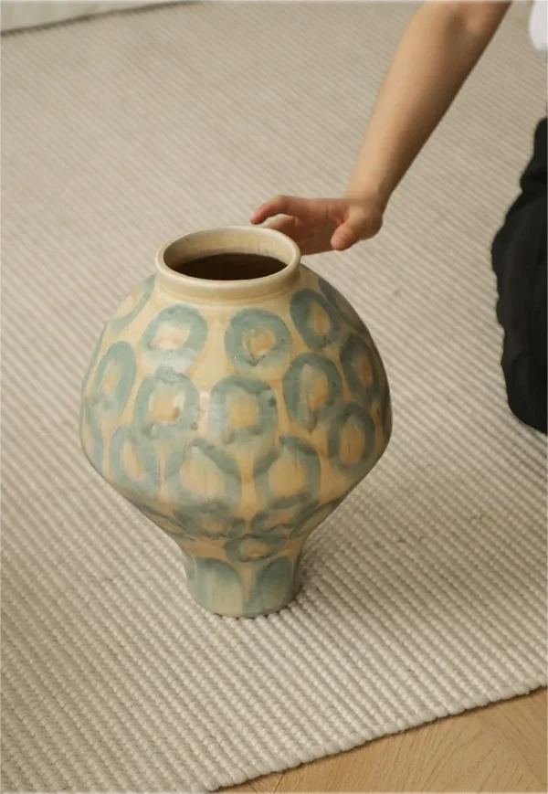 Jingdezhen Celadon Circle Pattern Round Jar Vase, Large in olive — in a room setting