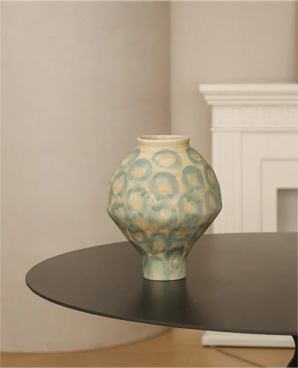 Jingdezhen Celadon Circle Pattern Round Jar Vase, Large in olive — in a room setting