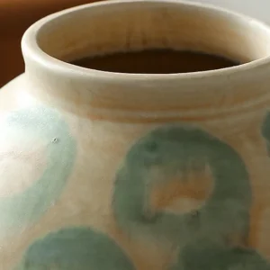 Jingdezhen Celadon Circle Pattern Round Jar Vase, Large in olive — in a room setting