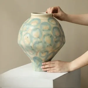 Jingdezhen Celadon Circle Pattern Round Jar Vase, Large in olive — in a room setting