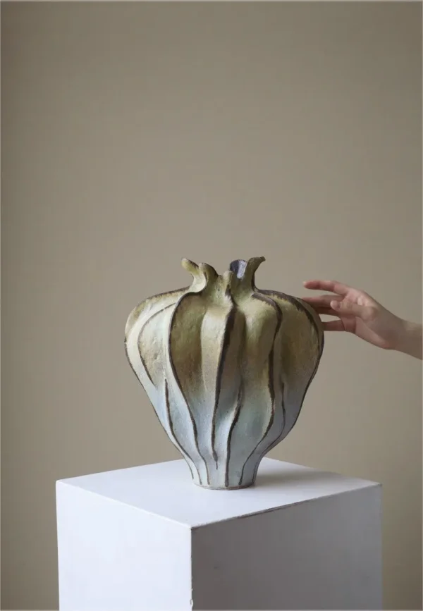 Jingdezhen Mountain and Water Lobed Art Vase, Large in olive — in a room setting