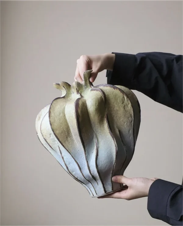 Jingdezhen Mountain and Water Lobed Art Vase, Large in olive — in a room setting