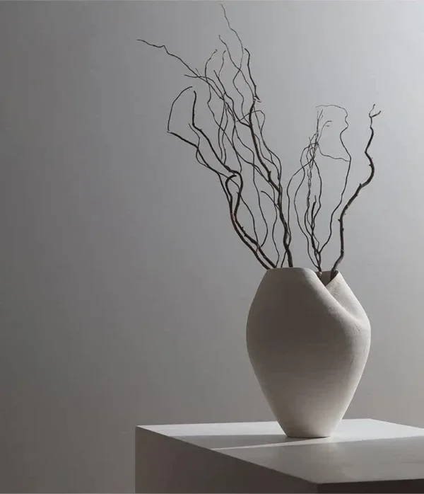 Jingdezhen White Round-Belly Ceramic Vase with Pinched Rim in ivory — in a room setting