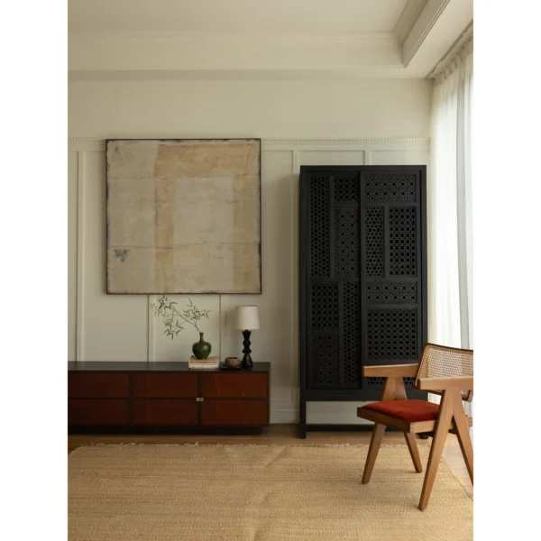 Jixing Teak Tall Cabinet with Pierced Star Sliding Doors in black — in a room setting