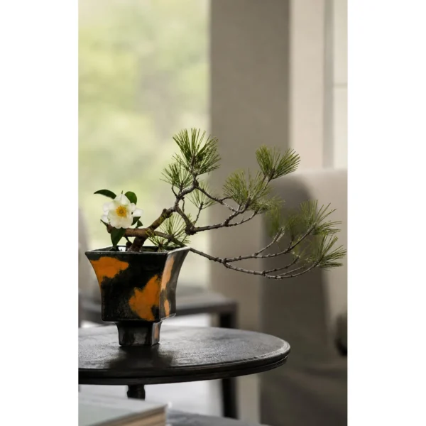 Kiln-Change Splash Glaze Square Stoneware Vase in black — in a room setting