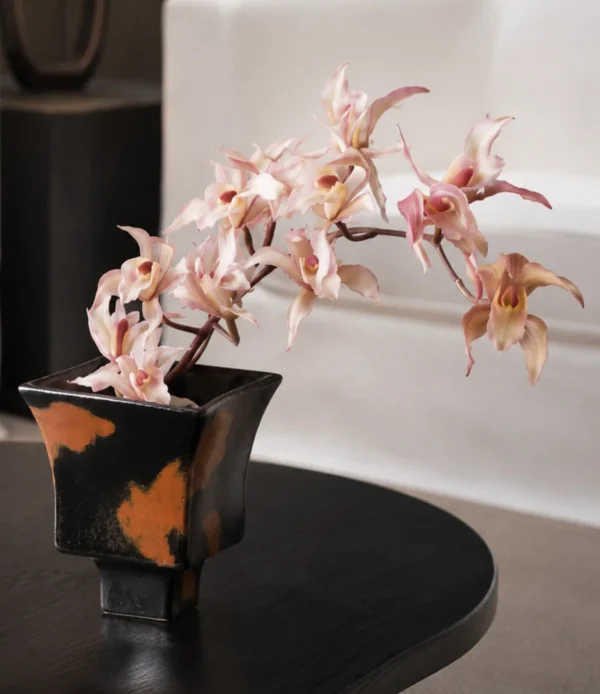 Kiln-Change Splash Glaze Square Stoneware Vase in black — in a room setting