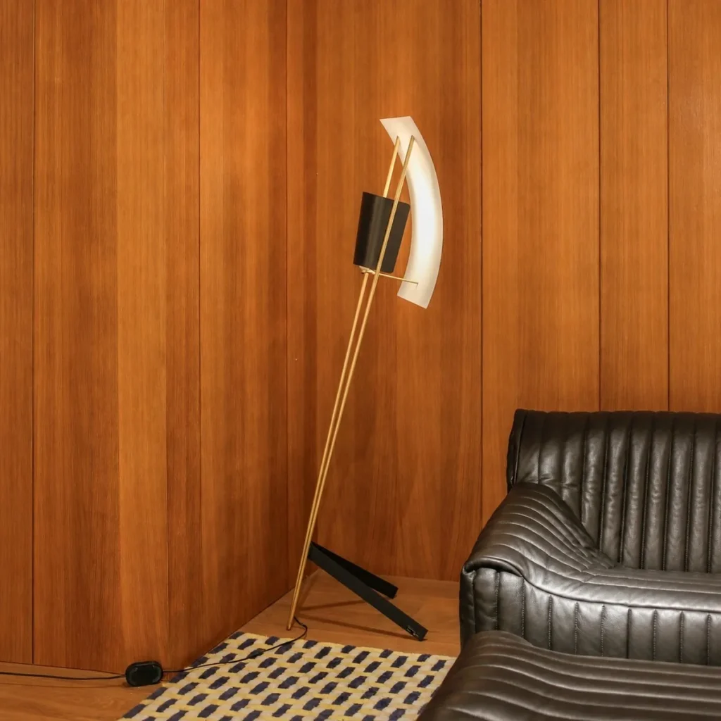 Kite Sculptural Floor Lamp with Perforated Curved Shade in brushed brass — front view