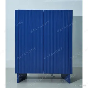 Klein Blue Fluted Lacquered Tall Cabinet in blue — in a room setting