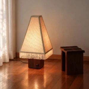 Kukeri Wood Base Floor Lamp with Fringed Pyramid Shade in oatmeal — front view