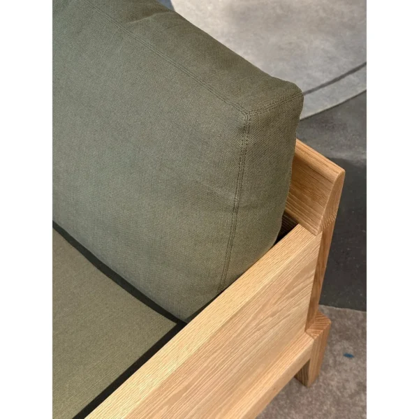 Oak Frame Lounge Chair with Olive Green Cushions in natural oak — in a room setting