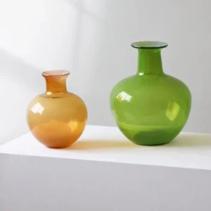 Glossy Coloured Glass Bottle Vases in Amber and Grass Green — front view