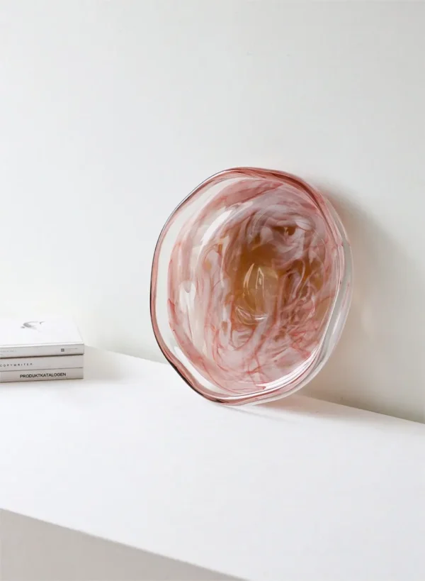 Hand-Blown Pink Marbled Glass Bowl with Wavy Rim in rose stone — in a room setting