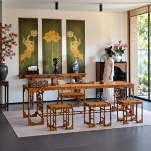 Long Bamboo Tea Table with Bamboo Armchairs in clay — in a room setting