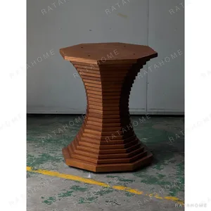 Stacked-Layer Octagonal Walnut Table Base in walnut — in a room setting