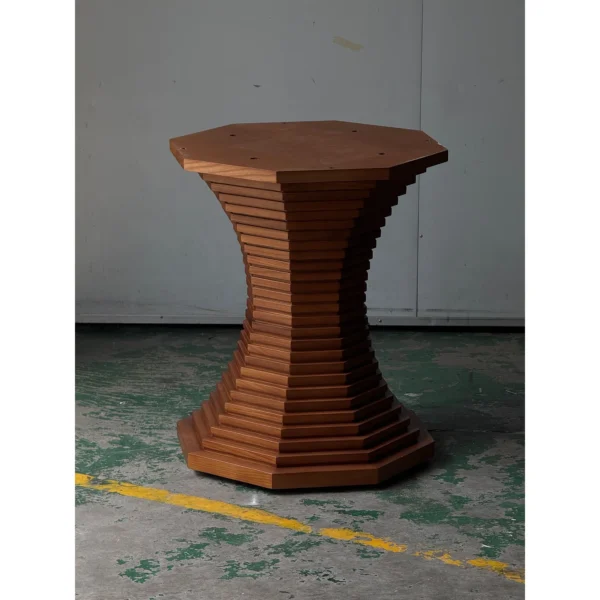 Stacked-Layer Octagonal Walnut Table Base in walnut — in a room setting