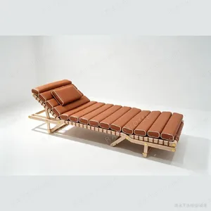 Leather Chaise Lounge Chair in stainless steel — in a room setting