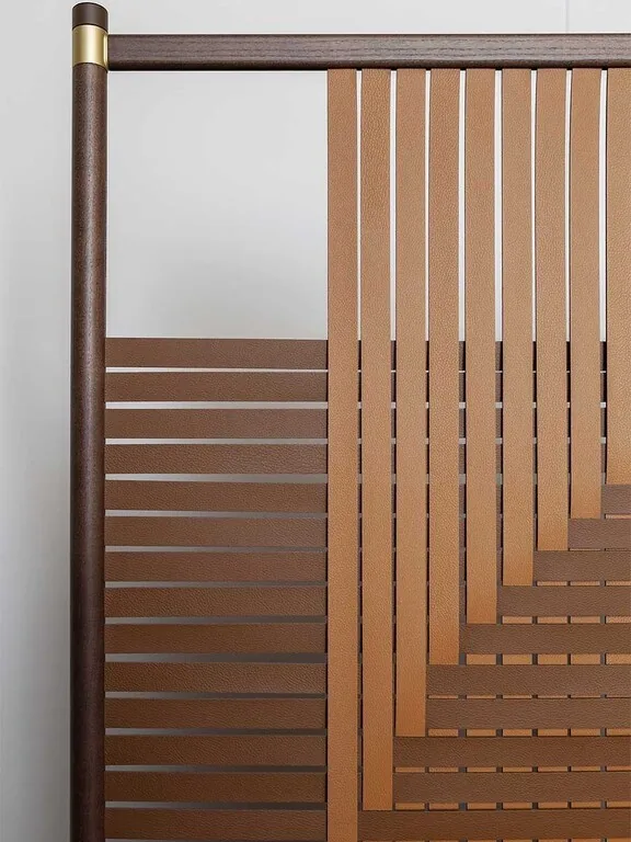 Woven Leather Geometric Screen in Wood Frame with Brass Feet — in a room setting