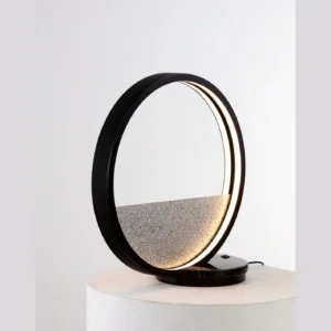 Leather Halo Table Lamp with Textured Half Disc in black — in a room setting