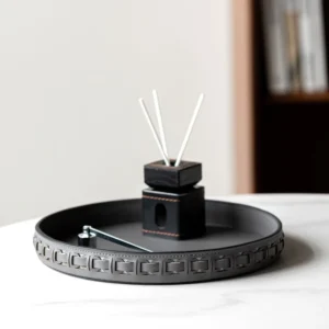 Round Black Leather Entryway Tray with Studded Rim in black — front view