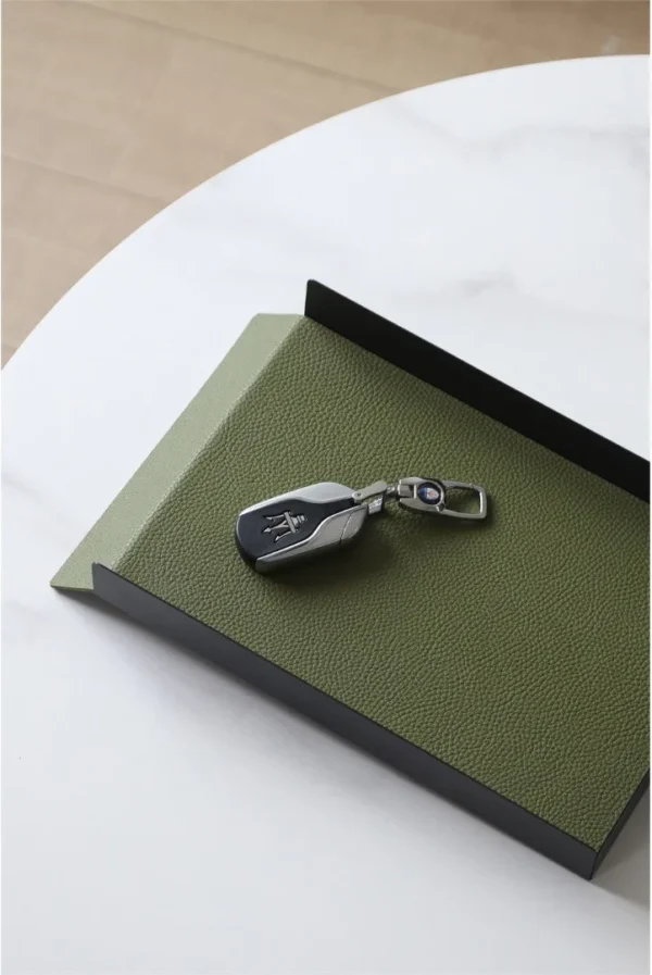 Round Leather Catch-All Tray with Strap, Navy, Green or Grey in blue — in a room setting