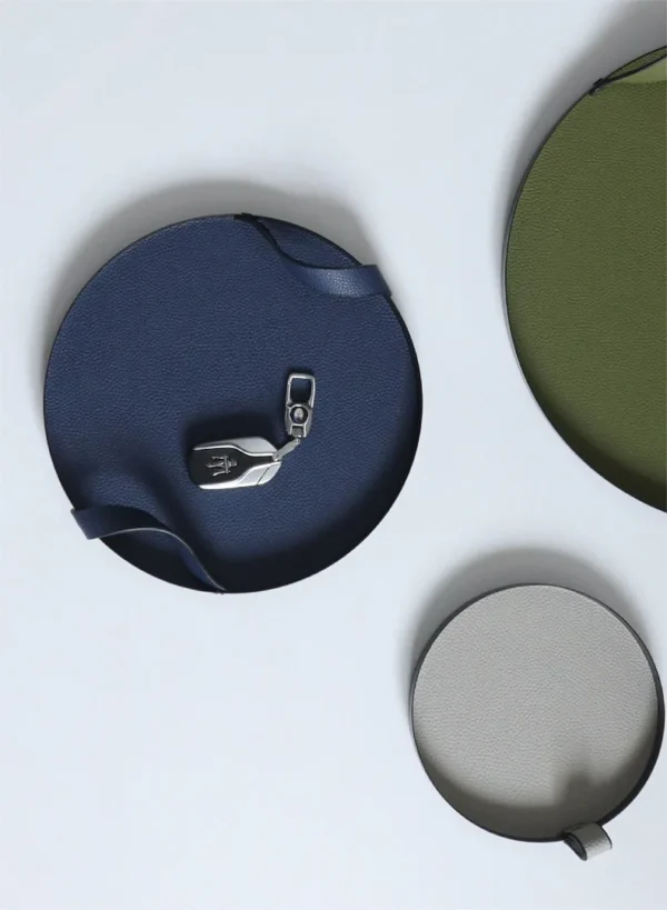 Round Leather Catch-All Tray with Strap, Navy, Green or Grey in blue — in a room setting