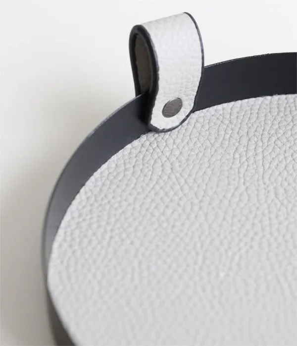 Round Leather Catch-All Tray with Strap, Navy, Green or Grey in blue — in a room setting