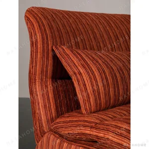 Leisure Lounge Chair with Ottoman in Orange Corduroy — in a room setting