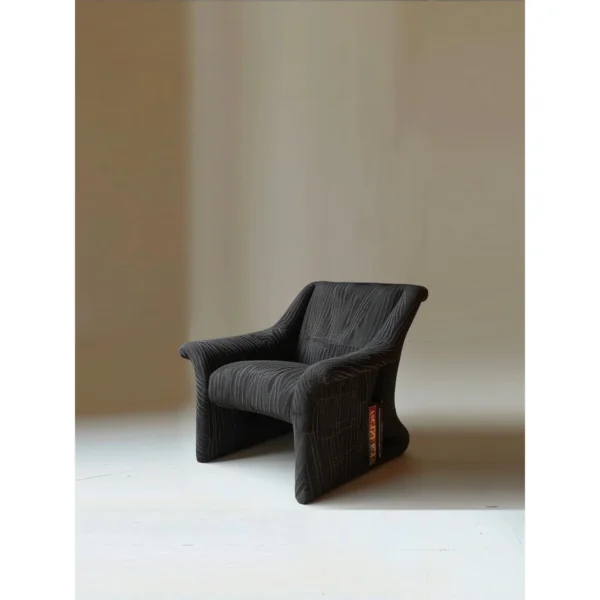 Leisure Wandering Lounge Chair in Pleated Charcoal Fabric — in a room setting