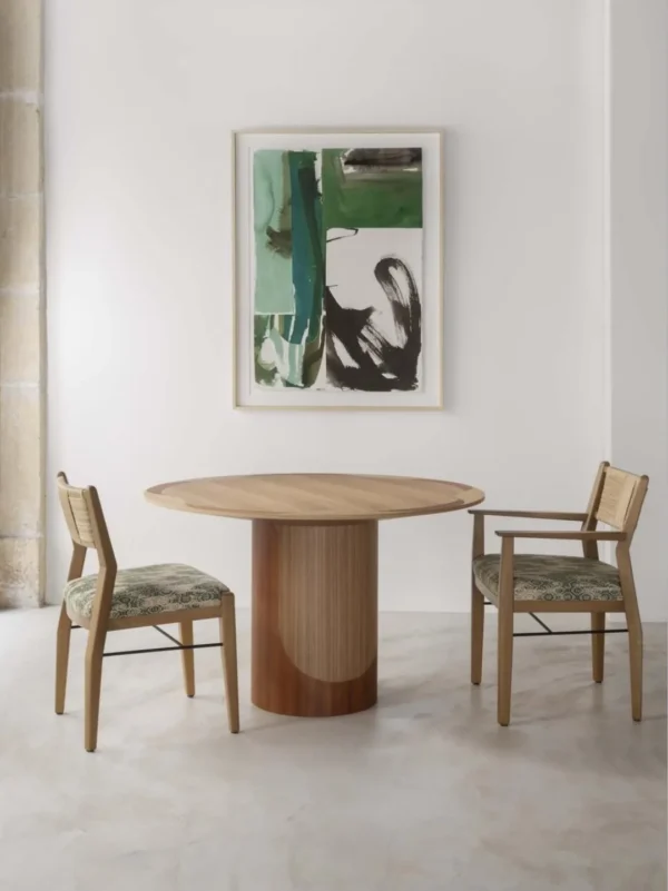 Inlaid Round Dining Table on Fluted Pedestal in natural oak — in a room setting