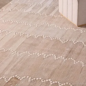 Light Khaki Wave Pattern Rug with Beaded Lines in sand — in a room setting