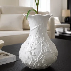 Lily of the Valley Relief White Ceramic Vase in ivory — front view