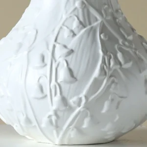 Lily of the Valley Relief White Ceramic Vase in ivory — in a room setting