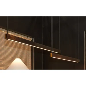 Linear Black Lava Stone Pendant Light in black — in a room setting