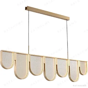 Linear Gold Wave Scale Pendant Light, 168 cm in brushed brass — in a room setting