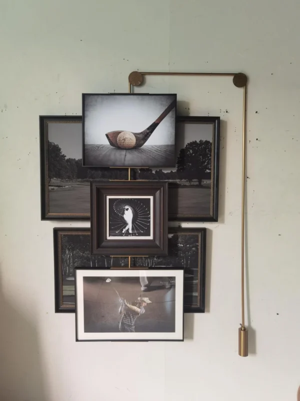Gallery Wall Art Set of 4 on Brass Hanging Rail in black — in a room setting