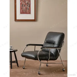 S-Curve Black Leather Lounge Chair in black — in a room setting