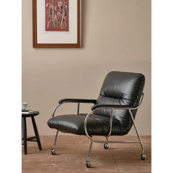 S-Curve Black Leather Lounge Chair in black — in a room setting