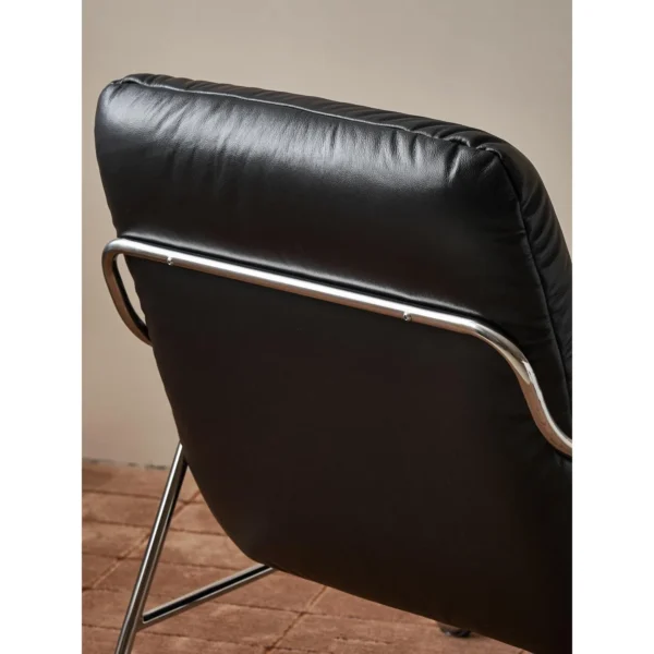S-Curve Black Leather Lounge Chair in black — in a room setting