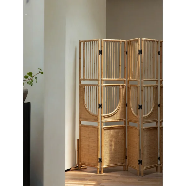 Long Summer All-Rattan Folding Screen with Butterfly Hinges in natural oak — in a room setting