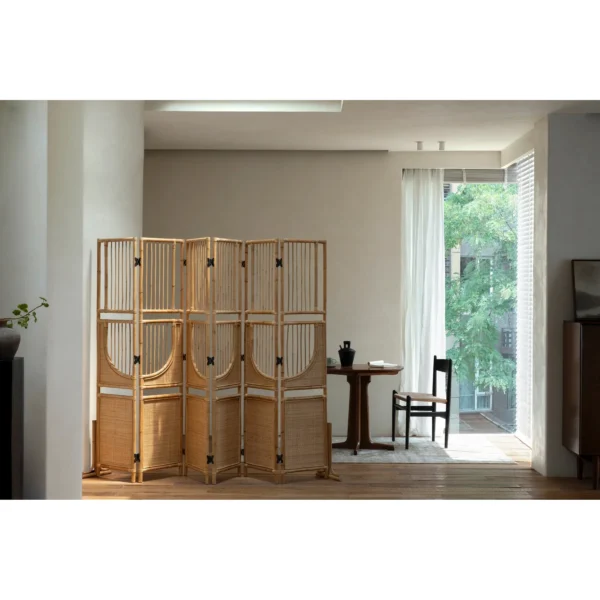 Long Summer All-Rattan Folding Screen with Butterfly Hinges in natural oak — in a room setting