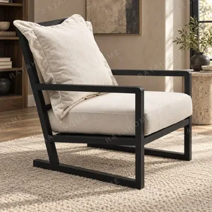 Black Wood Frame Lounge Chair with Cream Loose Cushions in black — in a room setting