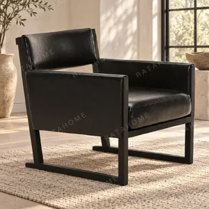 Black Leather Cube Lounge Chair on Sled Frame, 67 cm in black — in a room setting