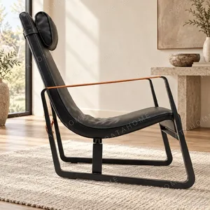 Black Leather Sling Lounge Chair in black — in a room setting