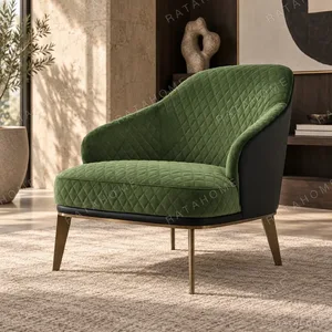 Green Quilted Velvet Tub Chair in olive — in a room setting